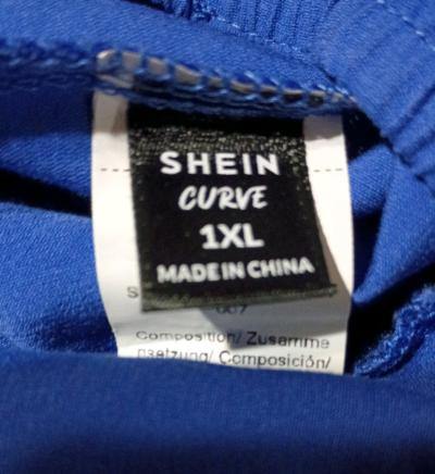 Beautiful blue jumpsuit with belly cut out by Shein - Thumbnail 4