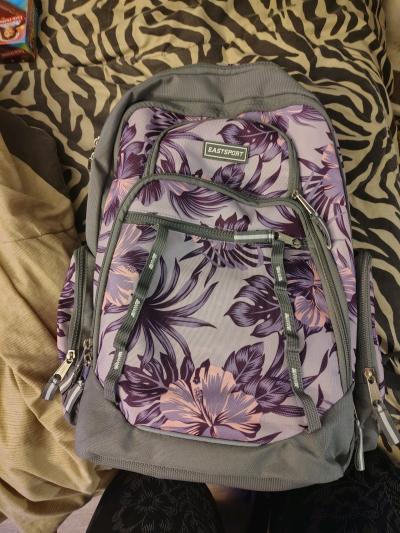 black rolling backpack and a purple non rolling backpack