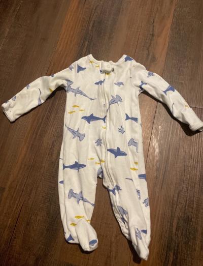 ten baby sleepers ranging in sizes 0 to 3 months