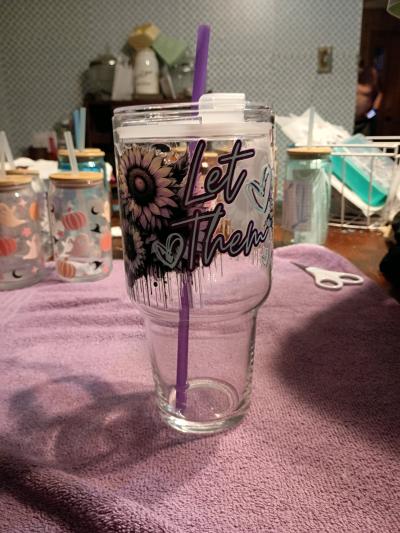 glass cup with straw and sticker