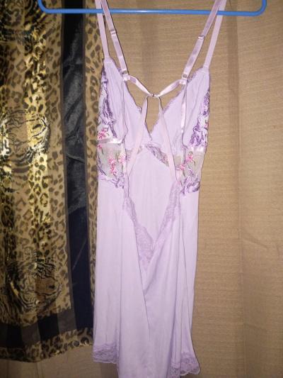 A Super Sexy Womans Purple New Lingerie Outfit with Flowers