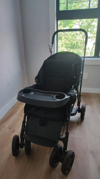 A Black Stroller built for 2 small children - Thumbnail 3