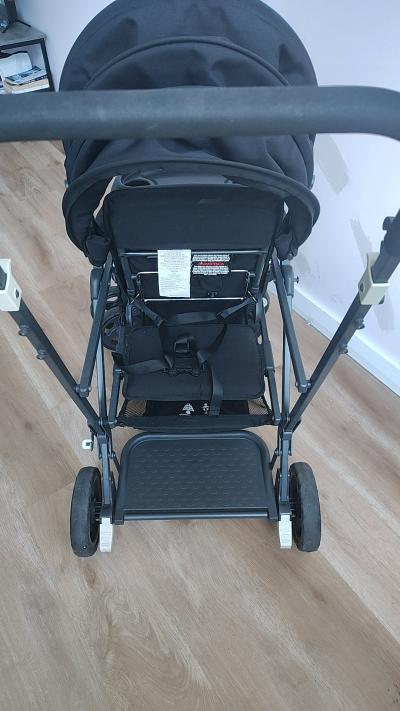 A Black Stroller built for 2 small children - Thumbnail 2