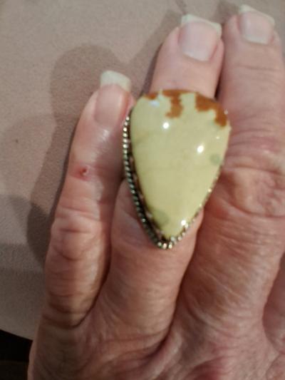 Brown an cream color mans ring