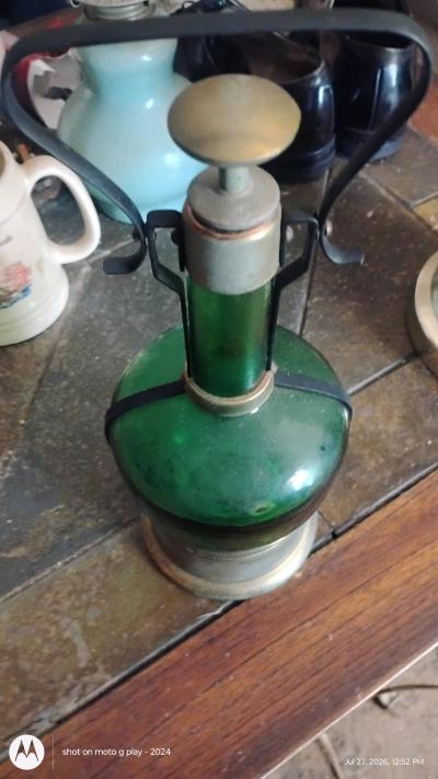 antique liquor bottle with built in music box on bottom