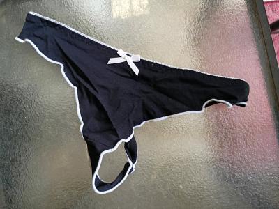 A Sexy Womans New Pair of Black and white thong panties