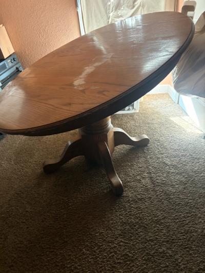 round kitchen table with 3 bar height chairs will sit 4 peop