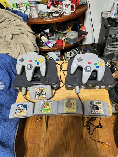 2 Nintendo 64 consoles with games