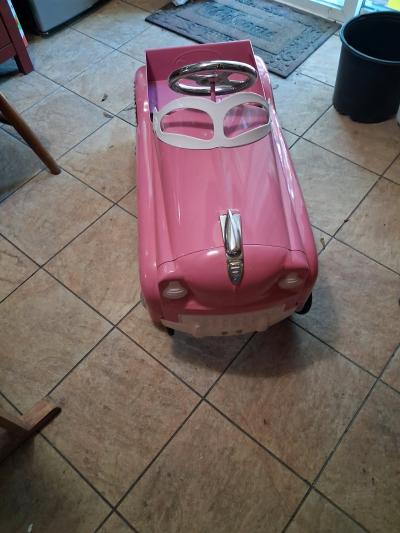 Brandnew neverused vintagestyle pink metal pedal car with cl
