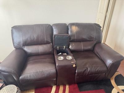 Brown Leather Reclining Loveseat with storage and cup holder
