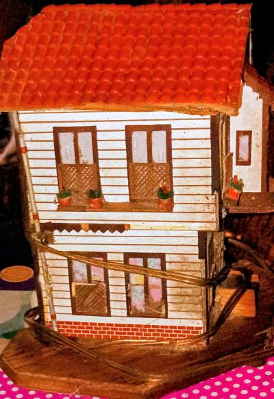 Plastic House with windows with light in them