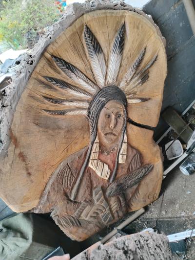 wood carving with horse and Indian