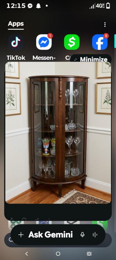 a wooden display curio cabinet