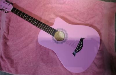 pink guitar and accessories