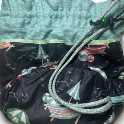 drawstring beach print bucket bag in mint and black - Thumbnail 2