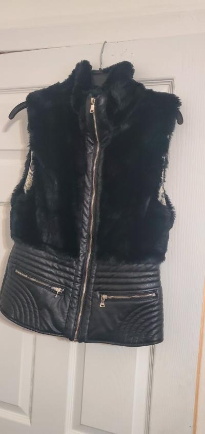 leather accent jacket by the brand Fate