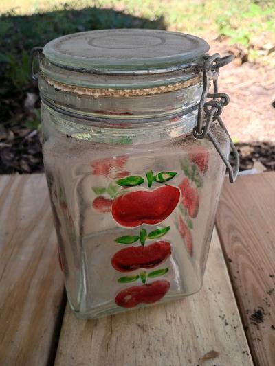 A Vintage Tall  Apple Glass Canister with Seal Snap  Lid