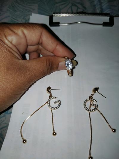 womens Gold earrings and a gold ring