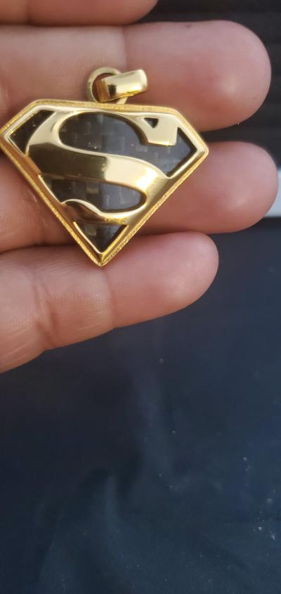 goldtoned Superman S shield pendan