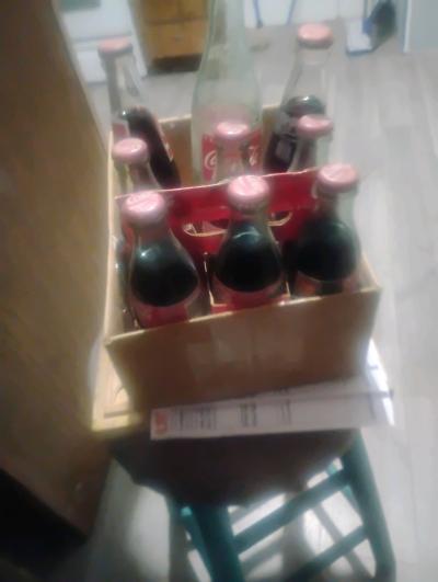 coca cola bottles full of drink