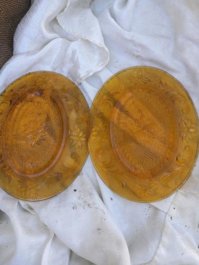A Matching Set of Two Gold Oval Smaller Plates
