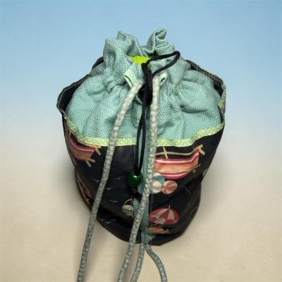 drawstring beach print bucket bag in mint and black