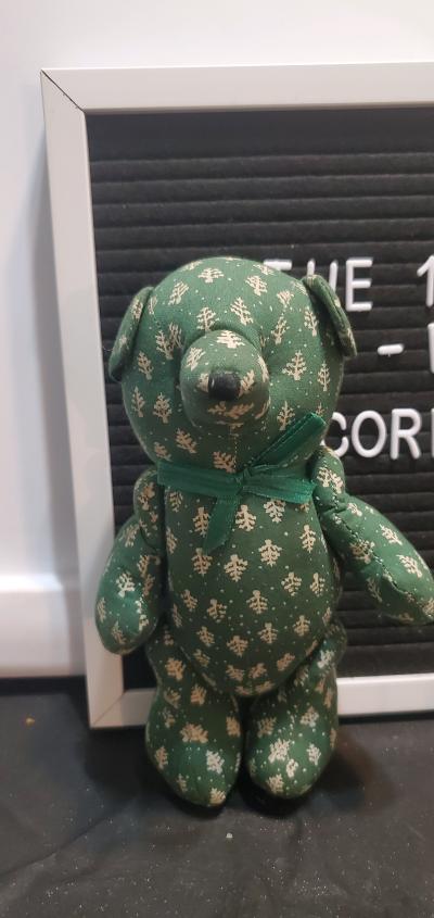 green patterned fabric teddy bear