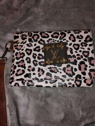 Louis Vuitton leopard print wristlet clutch